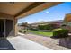Covered patio with brick flooring overlooking a well-maintained backyard at 4721 N Aldea W Rd, Litchfield Park, AZ 85340