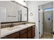 The bathroom features dual sinks with dark cabinets and a shower at 4721 N Aldea W Rd, Litchfield Park, AZ 85340