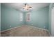 Neutral bedroom with plush carpeting, window with shutters, and ceiling fan at 4721 N Aldea W Rd, Litchfield Park, AZ 85340