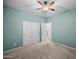 Spacious bedroom featuring plush carpeting, and double door closet at 4721 N Aldea W Rd, Litchfield Park, AZ 85340
