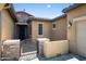 Close up of a decorative metal gate and stone facade, adding a touch of elegance to the front entrance of the home at 4721 N Aldea W Rd, Litchfield Park, AZ 85340