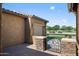 Covered patio and ornate metal gate entrance to the home, creating an inviting outdoor space with privacy and charm at 4721 N Aldea W Rd, Litchfield Park, AZ 85340