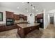 Well-equipped kitchen with an island, granite countertops, stainless steel appliances, and ample cabinet space for storage at 4721 N Aldea W Rd, Litchfield Park, AZ 85340