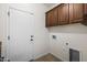 Laundry room with upper cabinets, and hookups for washer and dryer at 4721 N Aldea W Rd, Litchfield Park, AZ 85340