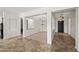 Living room and dining area featuring tile floors and neutral walls at 4721 N Aldea W Rd, Litchfield Park, AZ 85340