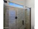 The bathroom features a glass shower with tile surround at 4721 N Aldea W Rd, Litchfield Park, AZ 85340