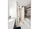 Bathroom featuring granite vanity, tiled shower and updated fixtures at 4838 W Christine Cir, Glendale, AZ 85308
