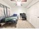 Bedroom featuring a ceiling fan, closet, and comfortable bed with stylish furnishings at 4838 W Christine Cir, Glendale, AZ 85308