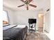 Bedroom highlighting a ceiling fan, window with curtains, desk and comfortable bed at 4838 W Christine Cir, Glendale, AZ 85308
