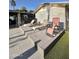 Wooden deck with multiple lounge chairs for outdoor relaxation, complemented by turf grass at 4838 W Christine Cir, Glendale, AZ 85308