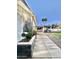 Exterior of the home with a well-maintained walkway and garden along side of the house at 4838 W Christine Cir, Glendale, AZ 85308