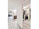 Hallway view showcasing the bathroom and a walk-in closet with ample storage at 4838 W Christine Cir, Glendale, AZ 85308