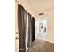 Hallway featuring a door to the patio, neutral paint, and carpeted floors at 4838 W Christine Cir, Glendale, AZ 85308