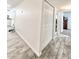 Hallway with wood-look tile flooring and closet at 4838 W Christine Cir, Glendale, AZ 85308