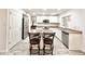 Spacious open kitchen with white cabinets, stainless appliances, and a center island at 4838 W Christine Cir, Glendale, AZ 85308