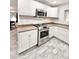 Kitchen featuring stainless steel appliances, granite countertops, and white cabinets at 4838 W Christine Cir, Glendale, AZ 85308