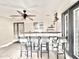 Outdoor bar with seating and ceiling fan on covered patio at 4838 W Christine Cir, Glendale, AZ 85308