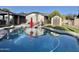 Backyard pool with view of yard and storage shed at 4838 W Christine Cir, Glendale, AZ 85308