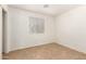 A well lit bedroom with tile floors, neutral walls and a window with blinds at 5439 W Sands Rd, Glendale, AZ 85301