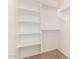 A closet space with built in shelving and rods for clothing at 5439 W Sands Rd, Glendale, AZ 85301