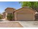Charming single-story home featuring a well-maintained front yard and an attached two-car garage at 5439 W Sands Rd, Glendale, AZ 85301