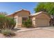 Attractive single-story residence showcasing a tidy yard and a practical two-car garage at 5439 W Sands Rd, Glendale, AZ 85301