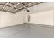 Spacious garage with a sealed floor, a water heater, and overhead storage, offering ample room at 5439 W Sands Rd, Glendale, AZ 85301