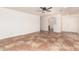 Open-concept living room boasts tile flooring and neutral walls perfect for customization at 5439 W Sands Rd, Glendale, AZ 85301