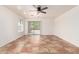 The spacious living room has neutral walls, tile flooring, ceiling fan and sliding door access to backyard at 5439 W Sands Rd, Glendale, AZ 85301