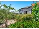 Charming backyard features colorful landscaping and a stone patio at 6145 S Adelle --, Mesa, AZ 85212