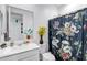 Bright bathroom with decorative shower curtain, white vanity, and modern fixtures at 6145 S Adelle --, Mesa, AZ 85212