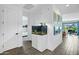 Bright hallway with modern flooring, decorative art, and a beautiful fish tank display at 6145 S Adelle --, Mesa, AZ 85212