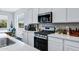 Bright kitchen with modern appliances, sleek countertops, and ample cabinet space at 6145 S Adelle --, Mesa, AZ 85212