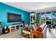 Comfortable living room featuring a media center, modern furniture, and bright natural light at 6145 S Adelle --, Mesa, AZ 85212