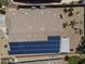 Aerial shot showcasing the home's roof with solar panels, a well-maintained yard, and outdoor fire pit at 6213 W Gambit Trl, Phoenix, AZ 85083