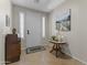 Comfortable foyer showing neutral walls, tiled floors, and decorative furniture at 6213 W Gambit Trl, Phoenix, AZ 85083