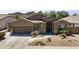 Charming single-story home with a well-manicured desert landscape, a tile roof, and an inviting front porch at 6213 W Gambit Trl, Phoenix, AZ 85083
