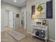 Inviting hallway with console table and decorative accents at 6213 W Gambit Trl, Phoenix, AZ 85083