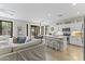 Bright kitchen with a large island, white cabinetry, stainless steel appliances, and bar seating at 6213 W Gambit Trl, Phoenix, AZ 85083
