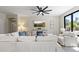 Spacious living room with large sofa, ceiling fan, and media console at 6213 W Gambit Trl, Phoenix, AZ 85083