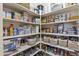 Organized pantry with shelves filled with various food and household items at 6213 W Gambit Trl, Phoenix, AZ 85083