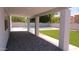 Covered patio overlooking pool and well-maintained backyard at 627 W Mendoza Ave, Mesa, AZ 85210