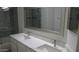 Elegant bathroom with double sinks, quartz countertop and decorative mirrors at 627 W Mendoza Ave, Mesa, AZ 85210