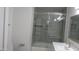 Updated bathroom featuring marble countertop vanity and frameless glass shower at 627 W Mendoza Ave, Mesa, AZ 85210