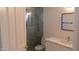 Updated bathroom featuring marble countertop vanity and frameless glass shower at 627 W Mendoza Ave, Mesa, AZ 85210