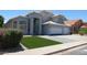 Well-maintained two-story home featuring a two-car garage, landscaped front yard, and inviting curb appeal at 627 W Mendoza Ave, Mesa, AZ 85210