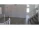 Inviting foyer with beautiful flooring, staircase, and a front door that offers natural light at 627 W Mendoza Ave, Mesa, AZ 85210
