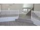 Welcoming entryway with staircase, white railings, neutral walls, and wood-look flooring at 627 W Mendoza Ave, Mesa, AZ 85210