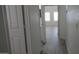 Hallway with white walls and wood-look floors at 627 W Mendoza Ave, Mesa, AZ 85210