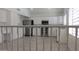 Well-equipped kitchen with stainless steel appliances, white cabinets, and a functional layout at 627 W Mendoza Ave, Mesa, AZ 85210